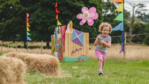 Child enjoying the Summer of Play event at Killerton, Devon
